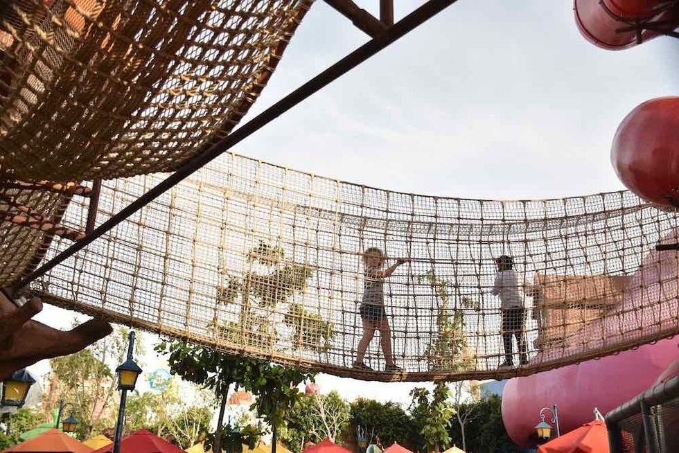 children play on bridge at motiongate dubai whitewater a (1)