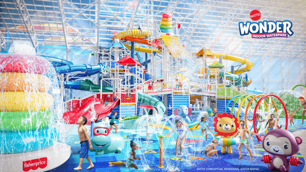 Children playing at Mattel indoor waterpark with slides and splash features.