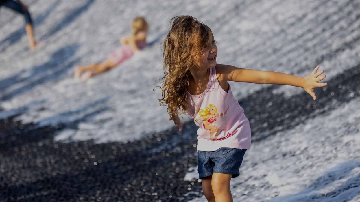 Children visit Surreal, the water feature