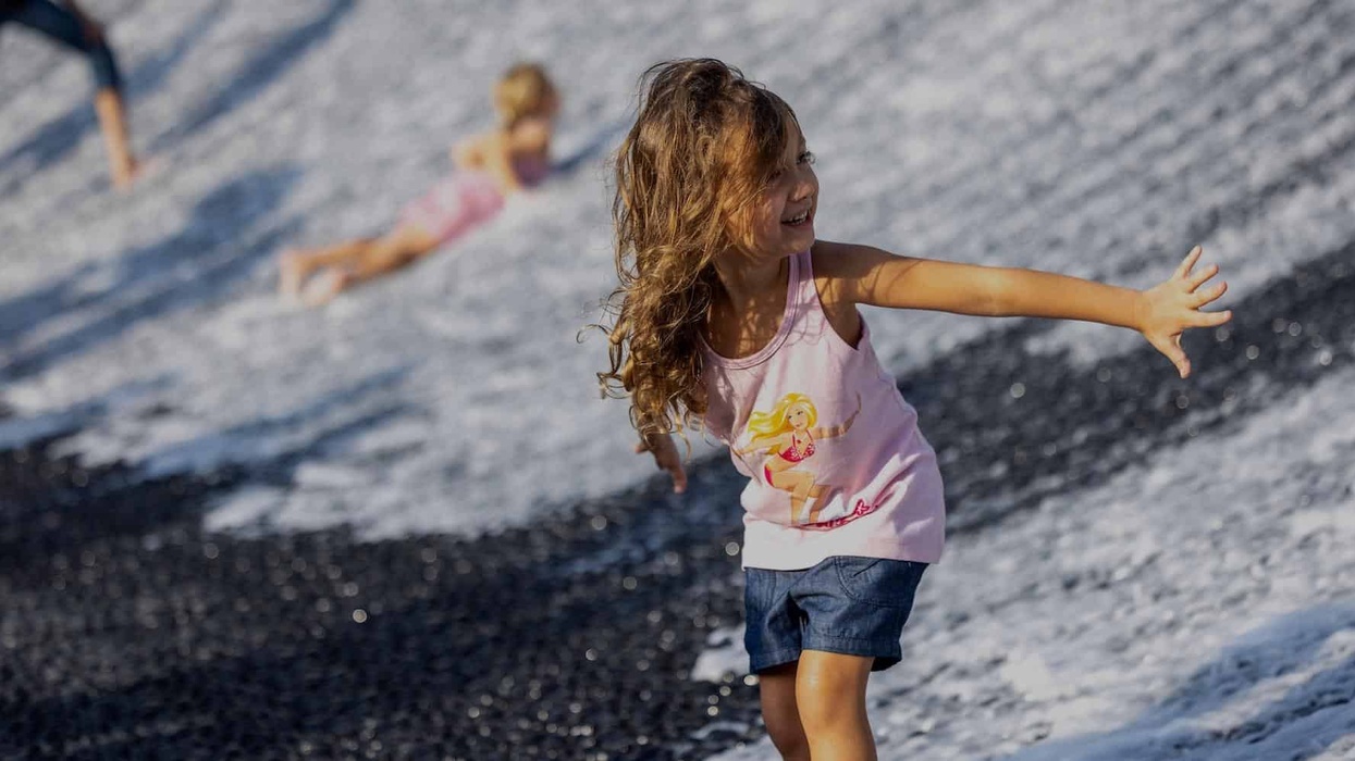 Children visit Surreal, the water feature