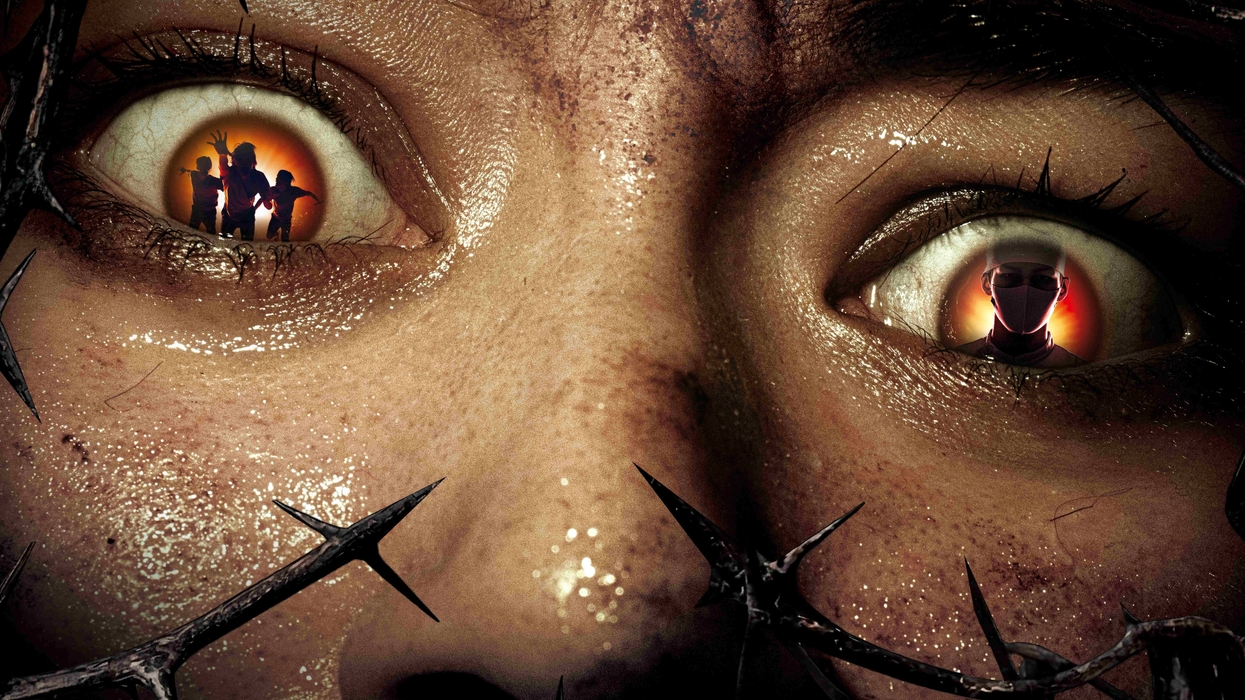 Close-up of eyes with reflections of zombie figures and thorns.