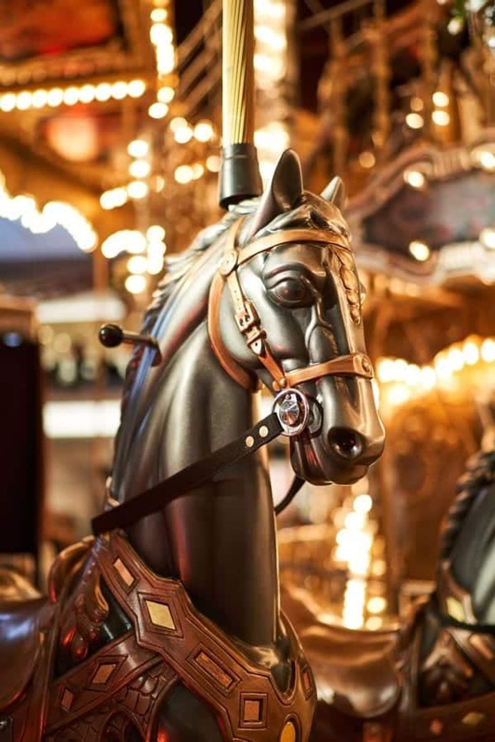 Close up photo of a horse on Mega Parc's Carrousel