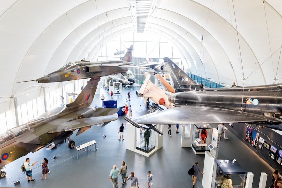Collection of fighter planes in the hangar Maggie Appleton
