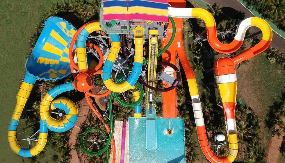 Colorful aerial view of winding water slides at Thermas dos Laranjais water park.