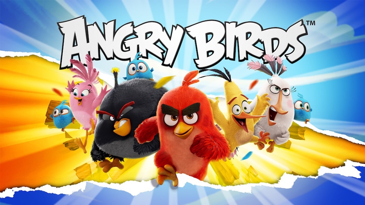 Colorful Angry Birds characters rushing forward with dynamic background.