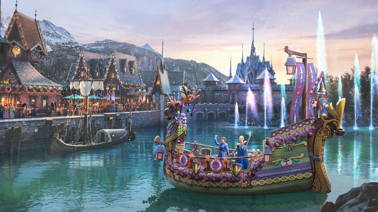 Colorful boat at a lakeside village with fountains and snowy mountains at Disneyland Paris' World of Frozen