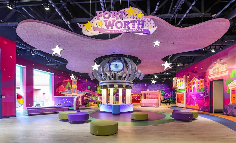 Colorful, futuristic children's museum exhibit with stars and interactive displays at Fort Worth Museum of Science and History