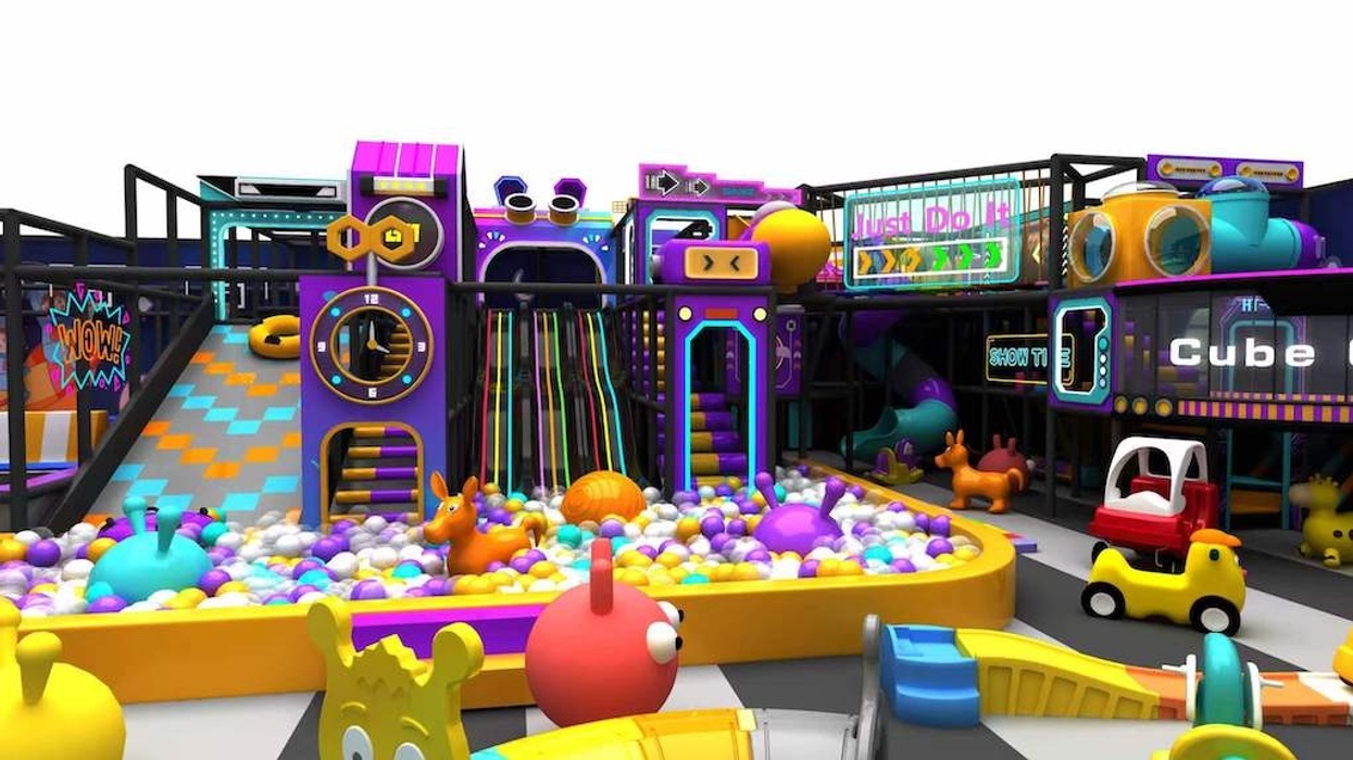 Colorful indoor playground with slides, ball pit, and toy vehicles.