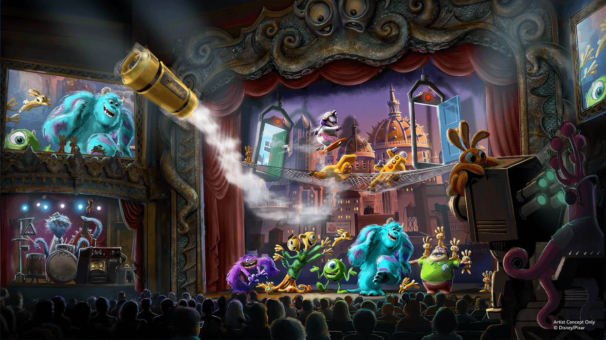 Colorful monsters performing on a lively stage in a whimsical theater at Disney World