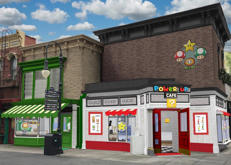 Colorful "Power Up Cafe" with gaming-themed decor and bright signs.