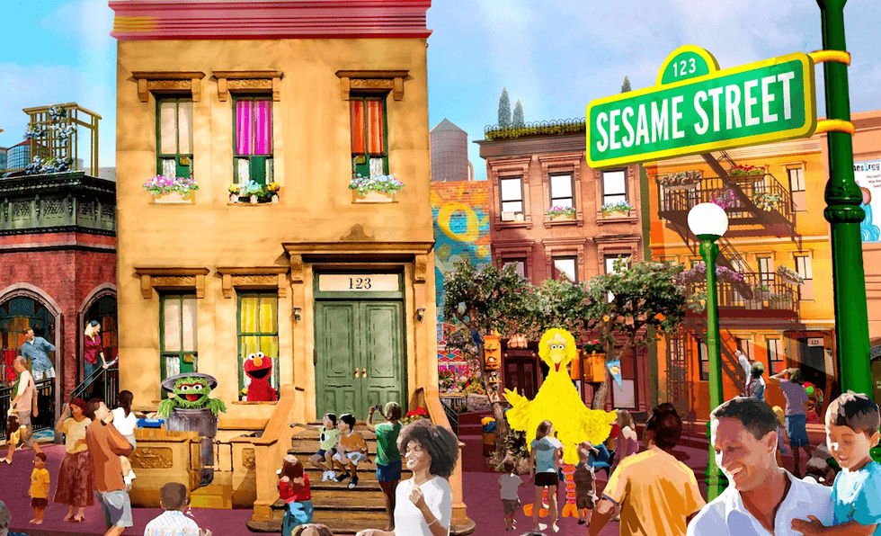 Colorful scene on Sesame Street with characters and families.