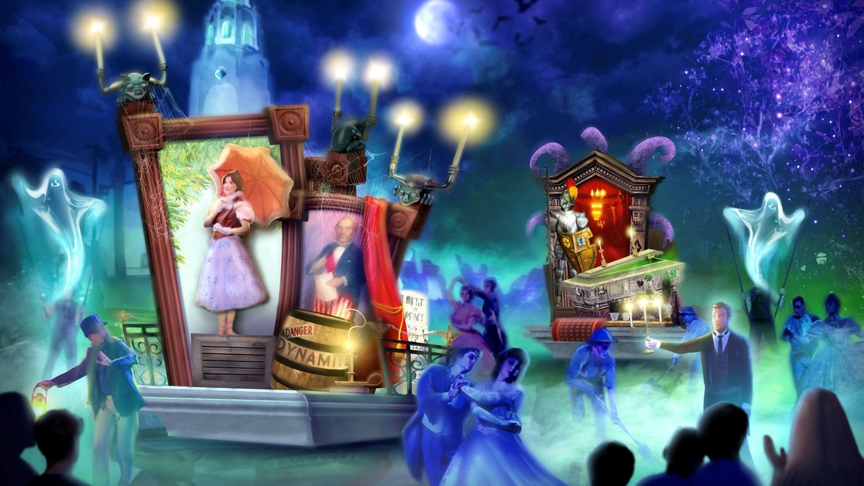 Colorful, spooky-themed parade at Disneyland with ghosts and dancers at night.