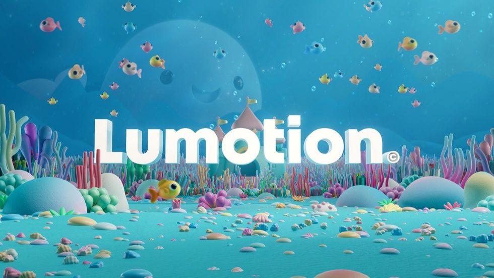 "Colorful underwater scene with fish and corals, featuring 'Lumotion' in bold white letters."