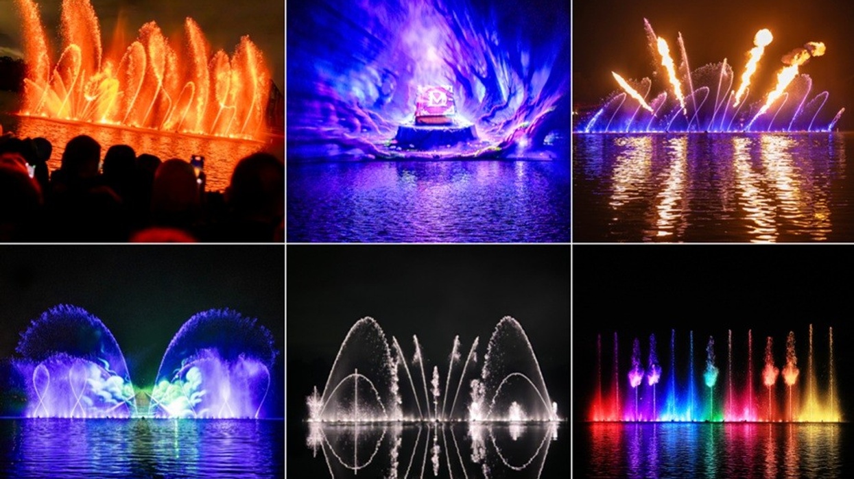 Colorful water and light show with fireworks over a reflective lake at night.
