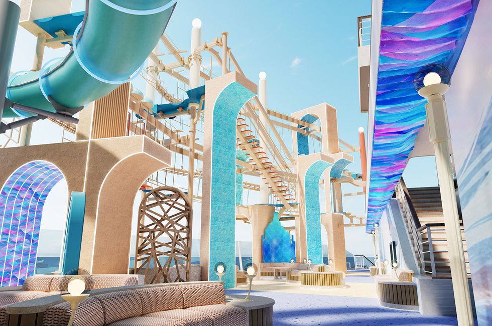 Colorful water park with slides, rope course, and seating under a clear blue sky.