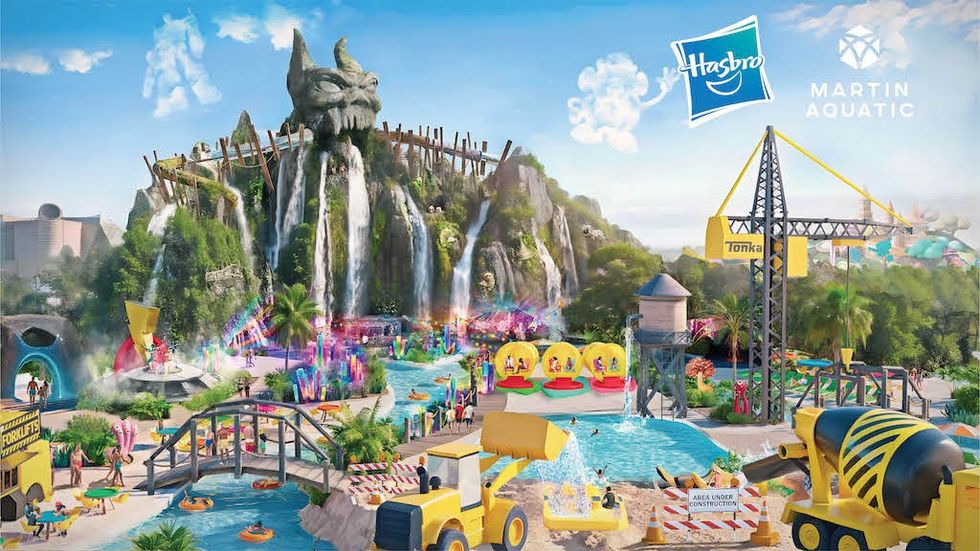 Colorful water park with waterfalls, toy-themed rides, and tropical landscaping.