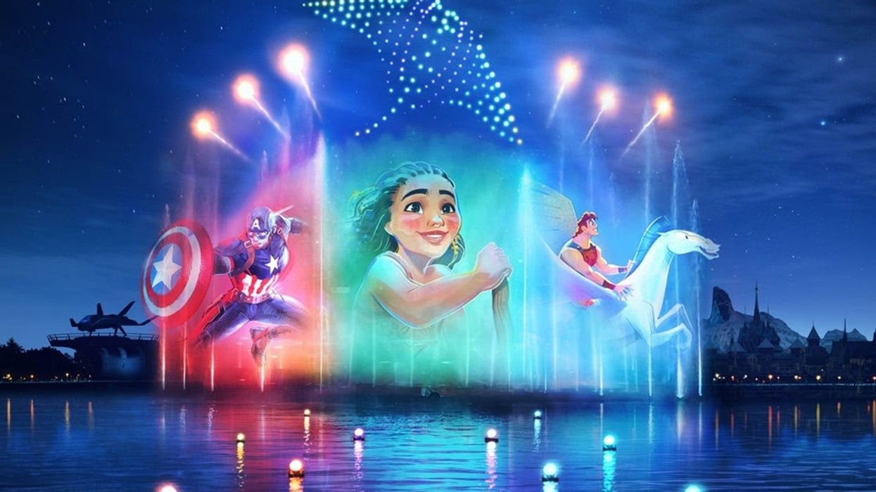 Colorful water show with animated characters projected onto fountains under a night sky.