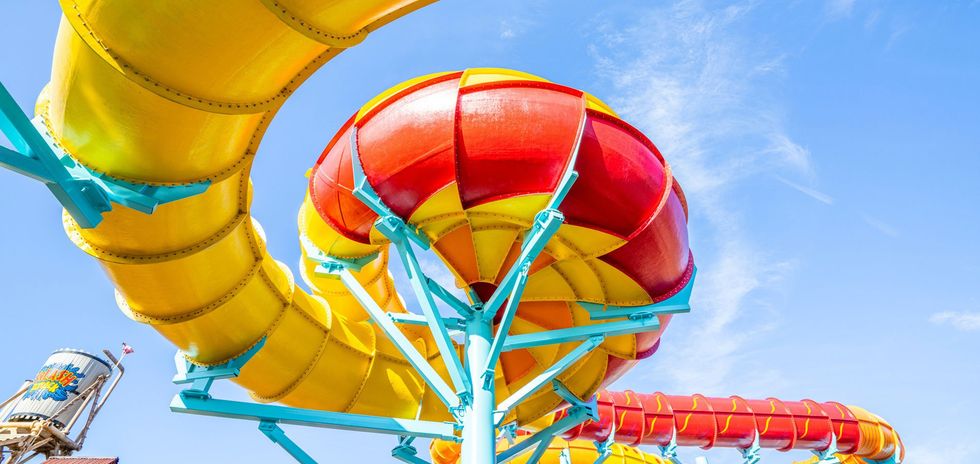 Colorful water slide against a clear blue sky at Adventure Island