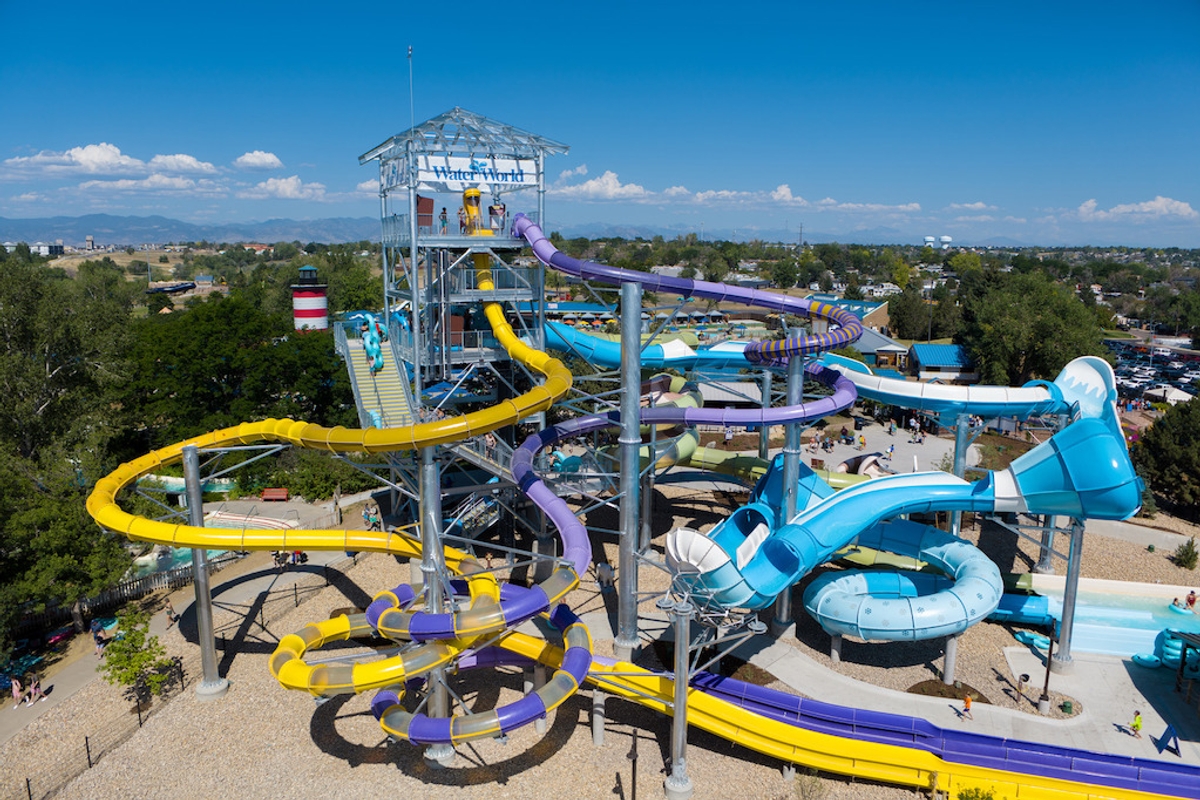 Colorful water slides at Water World under a clear blue sky.