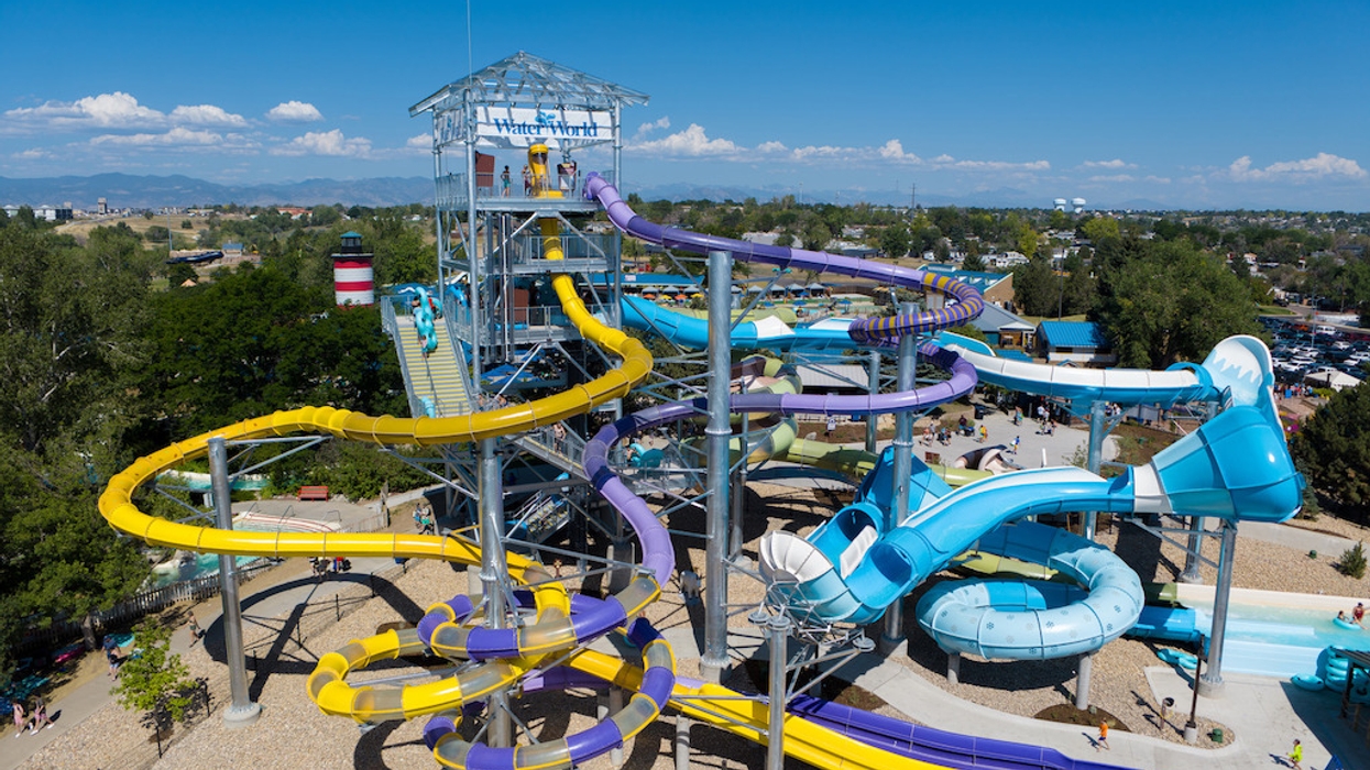 Colorful water slides at Water World under a clear blue sky.