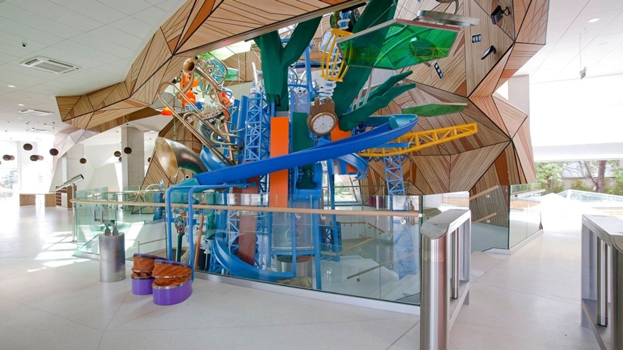 Colourful indoor playground with geometric design and various play structures at Muzeiko children's museum, Bulgaria.