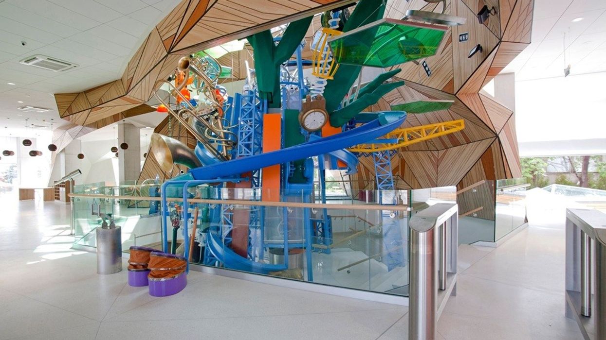 Colourful indoor playground with geometric design and various play structures at Muzeiko children's museum, Bulgaria.