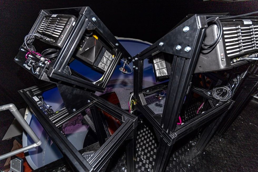 Complex, angular metal structure with electronic components and cables from Norxe