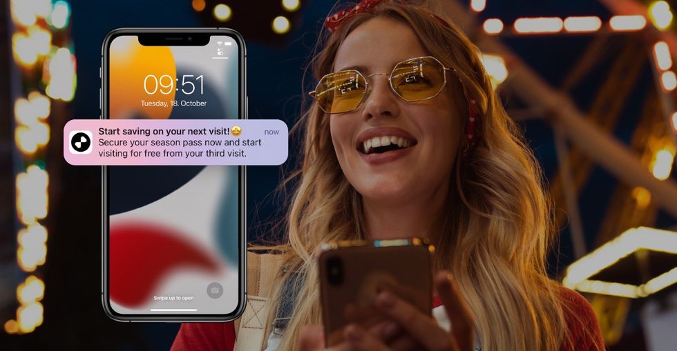 convious personalised engagement tools blooloop innovation awards 2022 woman on a phone with a personalised notification AI in attractions