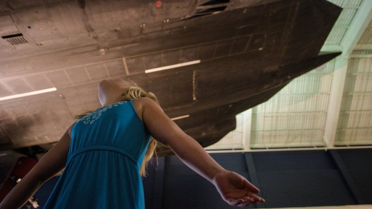 Cosmosphere Innovation Space girl looks at spacecraft (1)