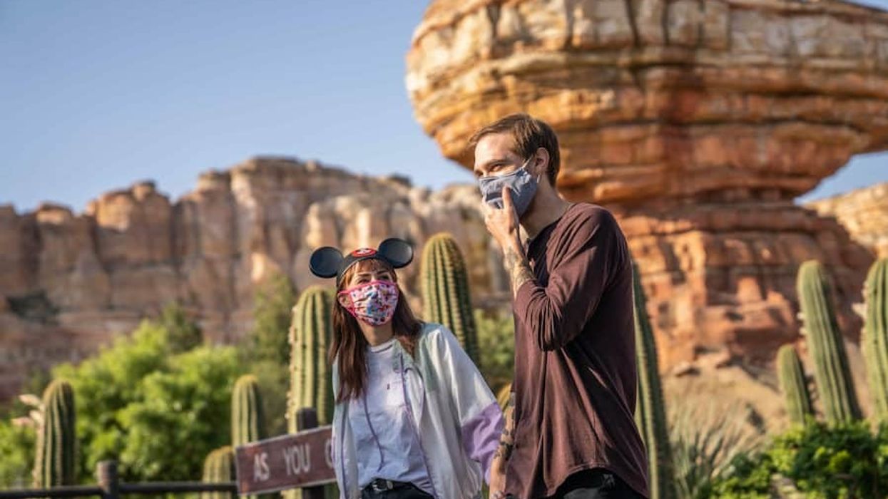 Couple at Disneyland in masks