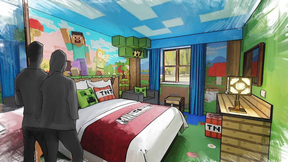 Couple in a Minecraft-themed room with blocky decor and game characters on walls.
