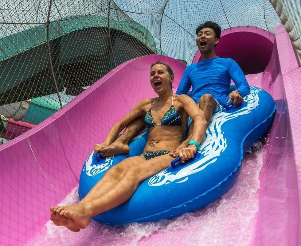 couple on water rockets raft slide wet'n'wild haikou