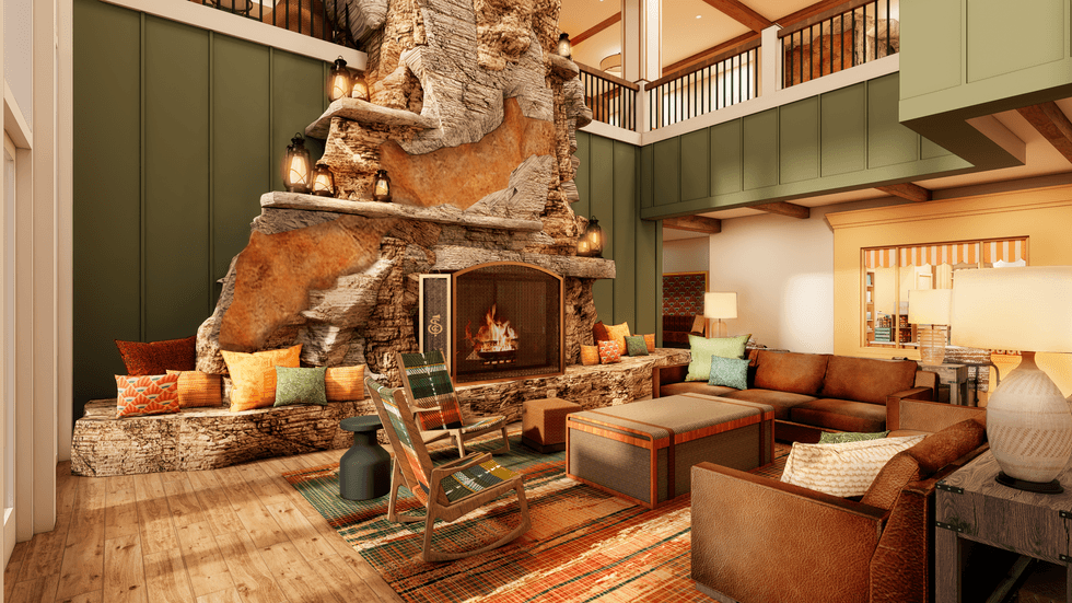 Cozy hotel area at Silver Dollar City Resort with a large stone fireplace and comfortable seating arrangement.