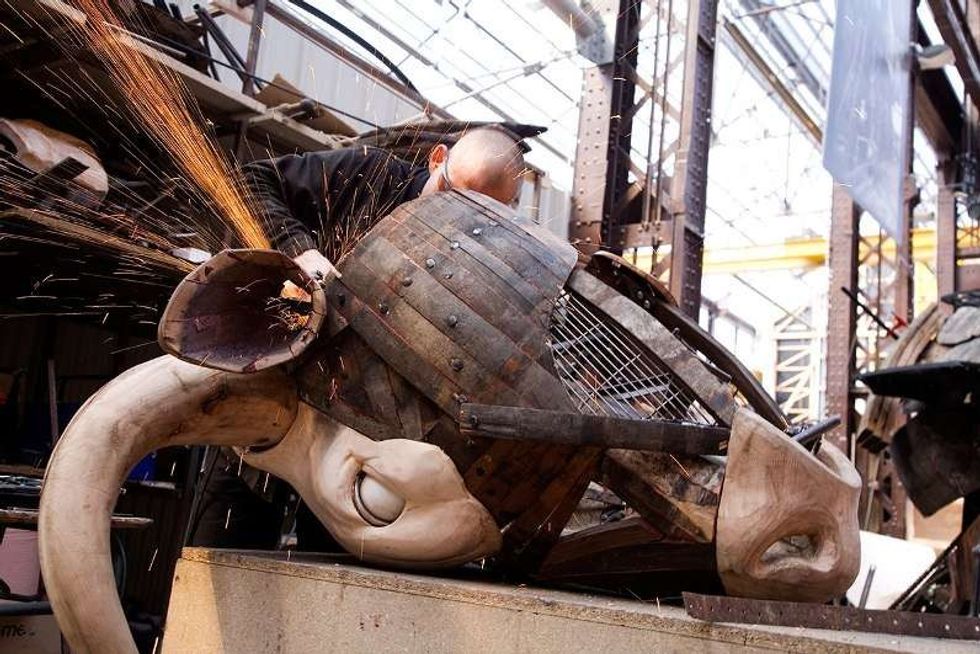 craftsman works on an elephant Les Machines de l'ile