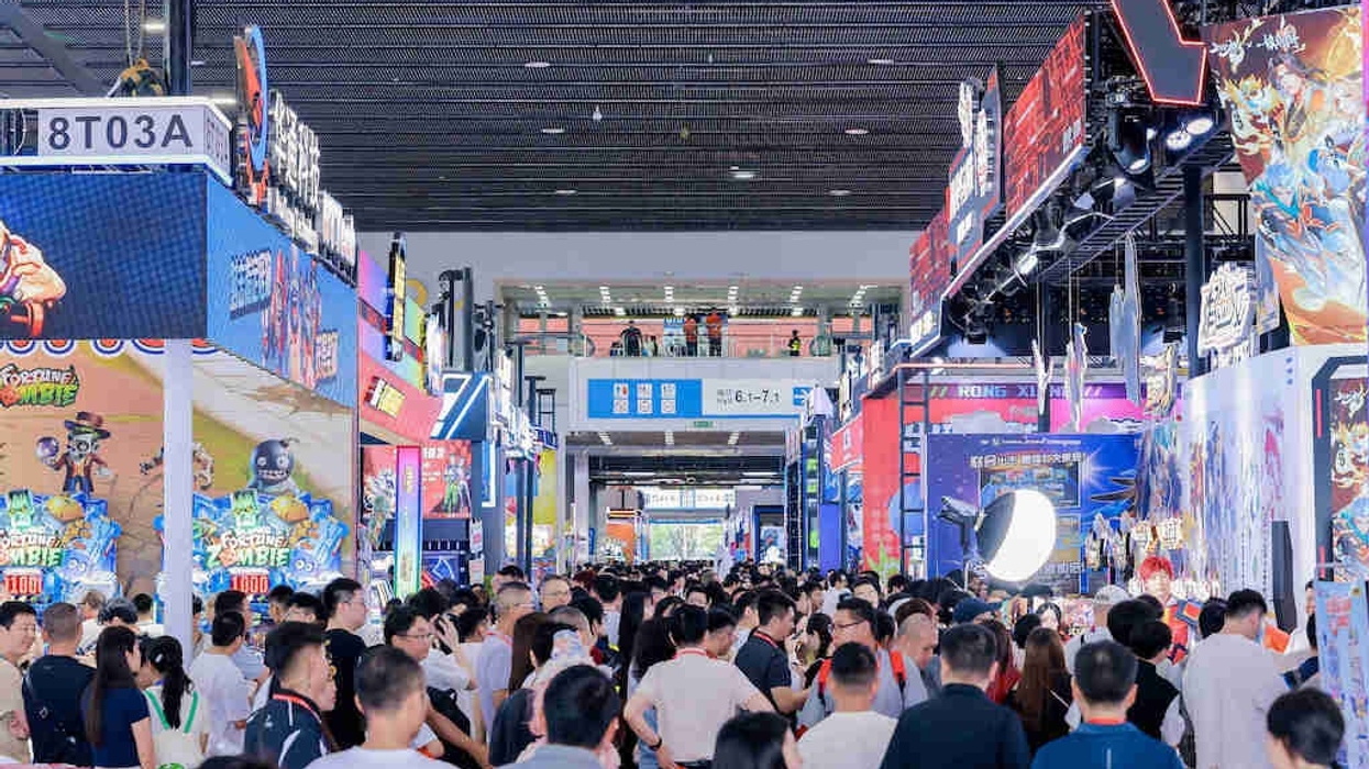 Crowded convention hall at GTI China Expo with colorful booths and banners.