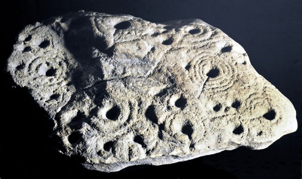 Cup and ring marked stone, 4000-2500 BC, sandstone, found at Gainford, County Durham The Bowes Museum, Barnard Castle