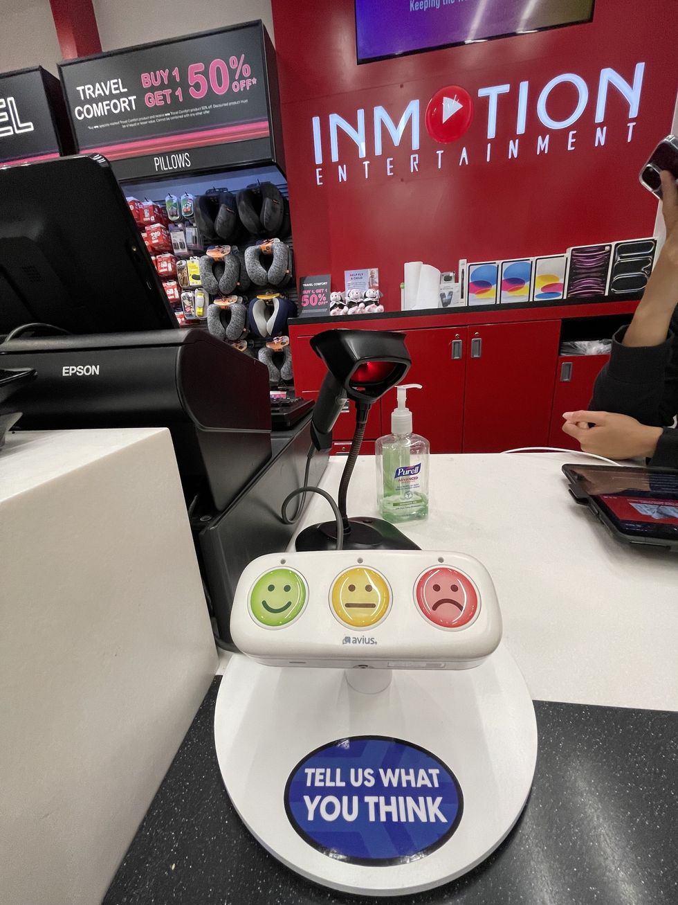 Customer feedback kiosk at InMotion Entertainment store counter.