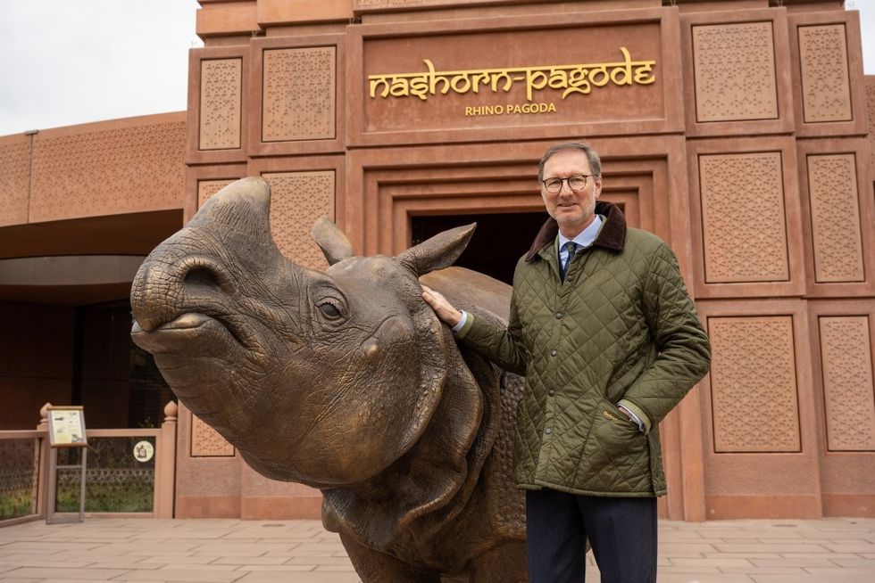 dan pearlman shares insights into zoo design Dr Andreas Knieriem and the rhino statue