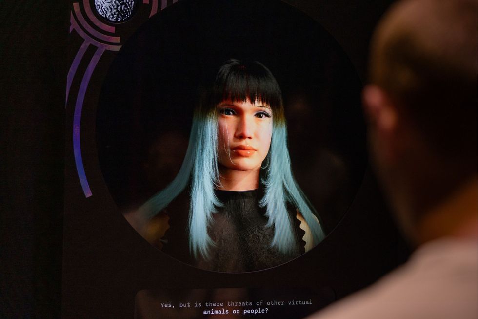 Digital portrait with teal-haired woman in focus, person in foreground blurred.