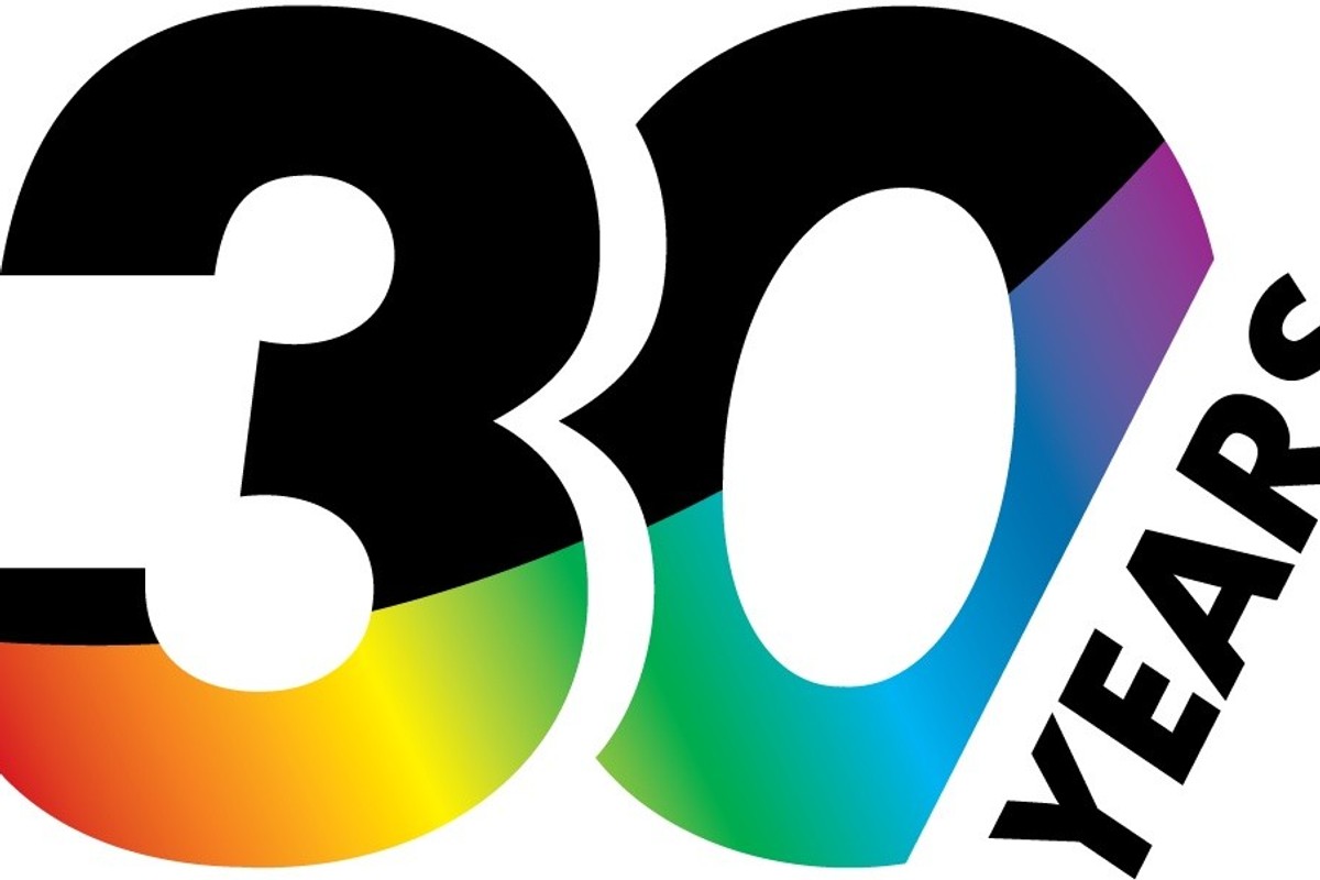 Digital Projection's "30 Years" logo with rainbow gradient inside the number.