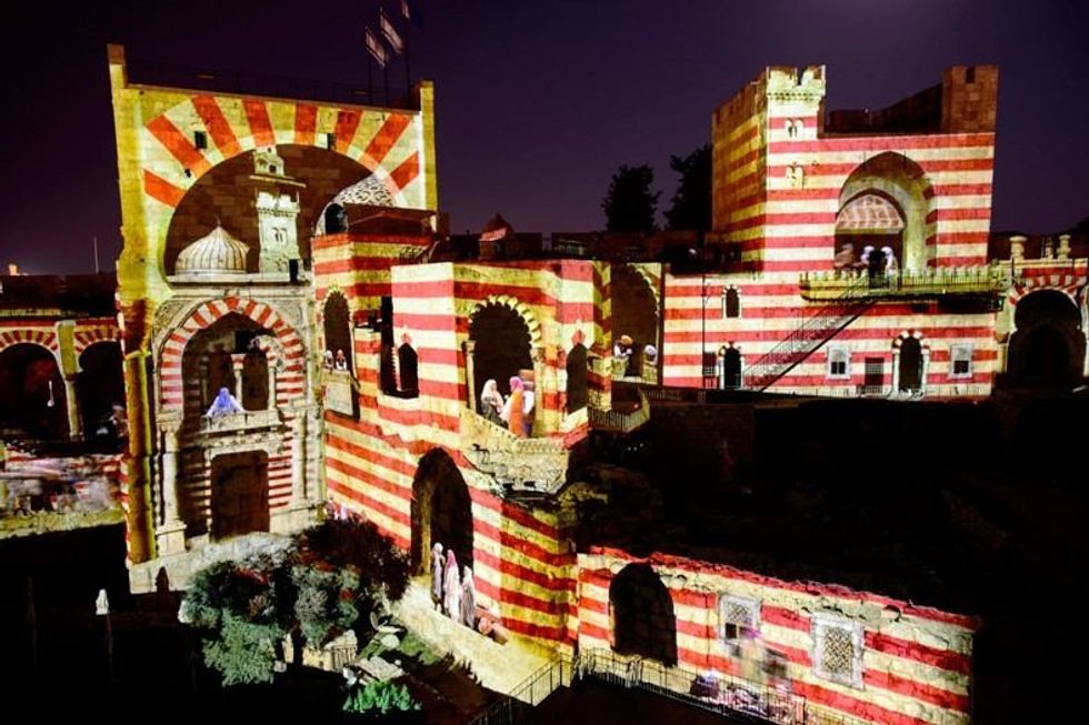 digital projection tower of david night spectacular showing arabni people inhabiting the Citadel
