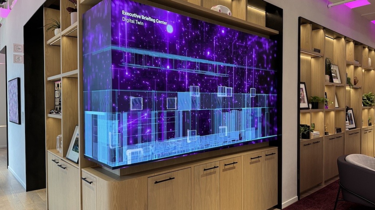 Digital twin display in modern office with wooden shelves and ambient lighting.