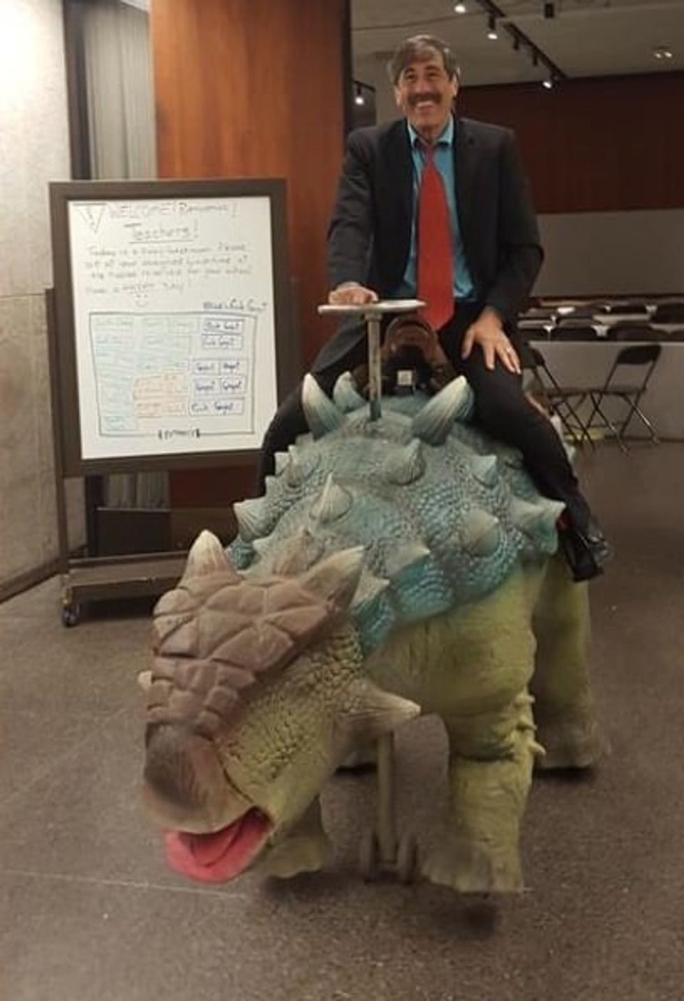 Dino Don riding dinosaur