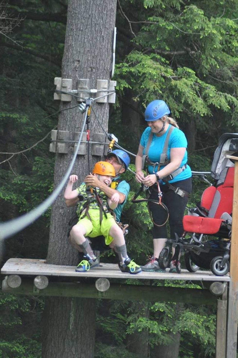 disabled child on zipline at treetop eco adventure park