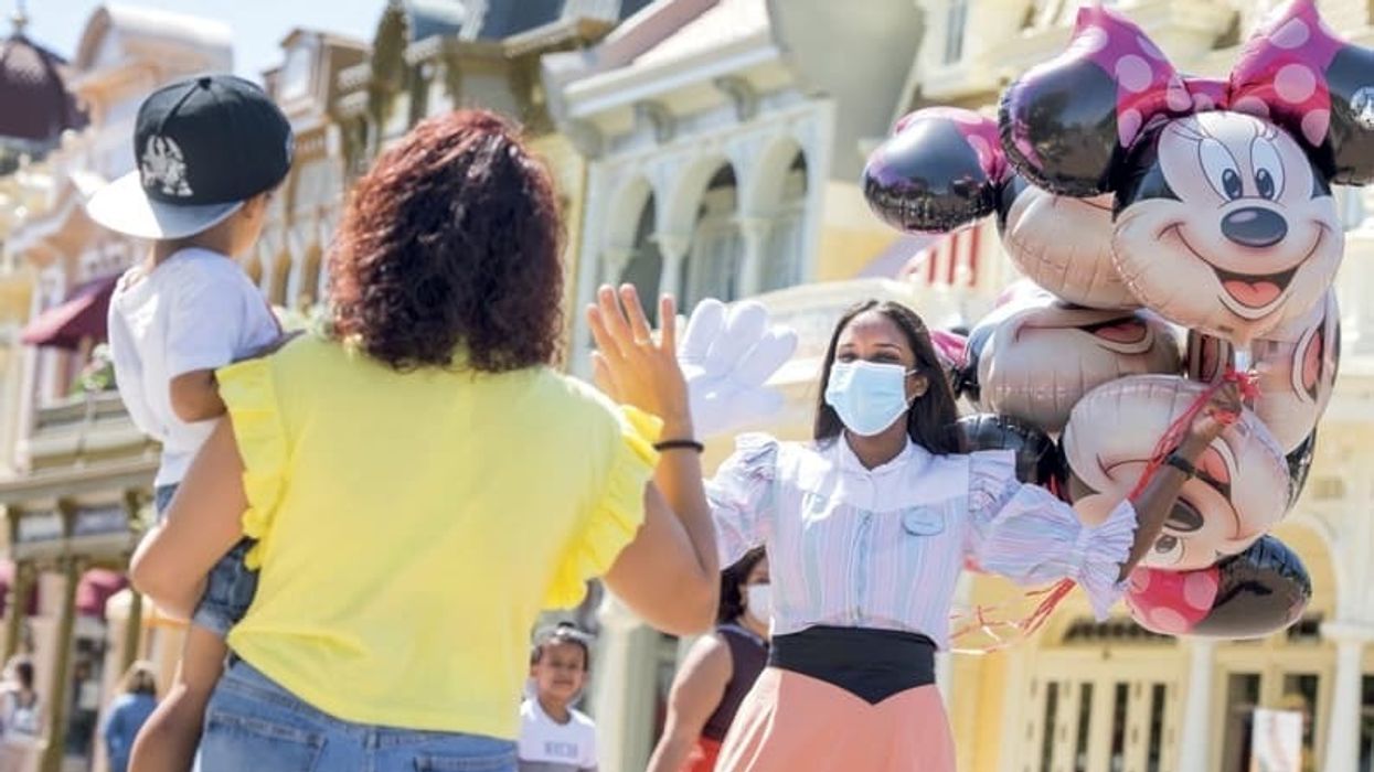 Disneyland Paris cast member waves