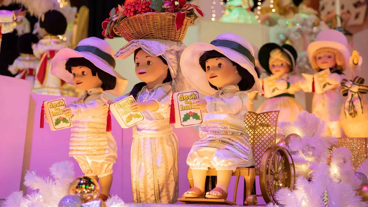 disneyland small world dolls in wheelchairs