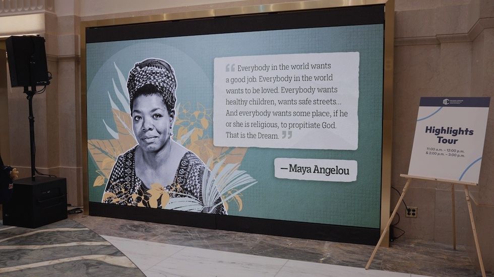 Display featuring a Maya Angelou quote and portrait, with a nearby "Highlights Tour" sign.