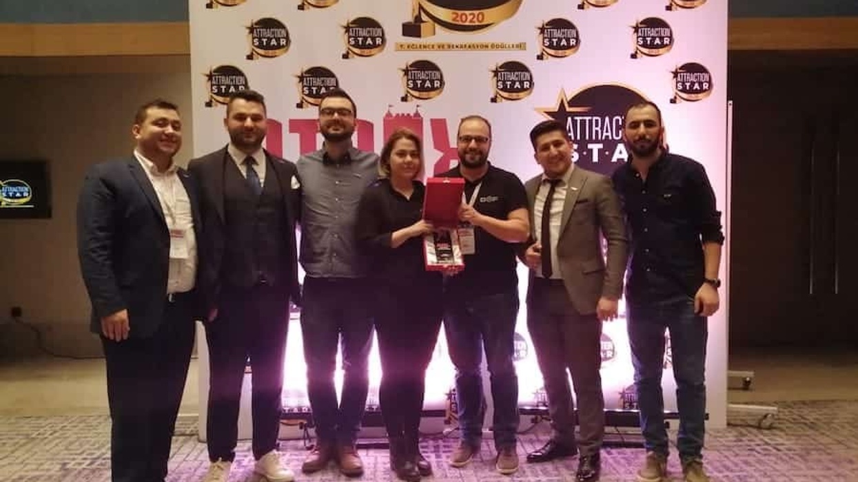 DOF Robotics team receiving Attraction Star Award at ATRAX show