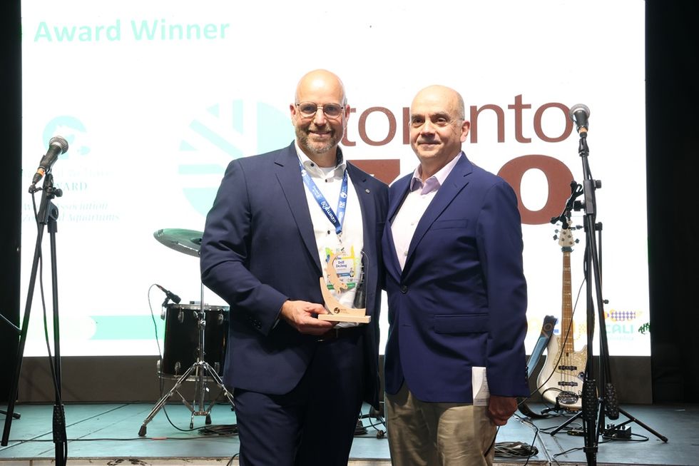 Dolf De Jong (left), CEO of Toronto Zoo, receives the WAZA Animal Welfare Award from Dr Alejandro Grajal (right) \u00a9Cali Zoo and WAZA 2025