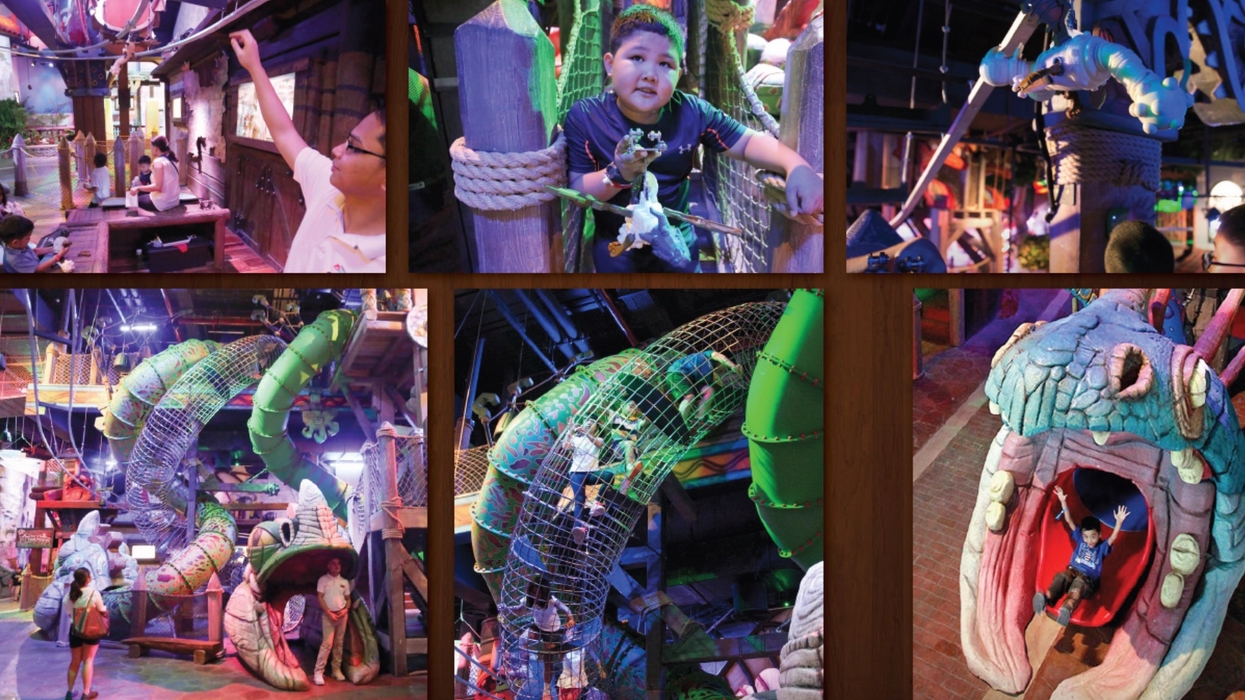 DreamWork DreamPlay Children playing in a colorful indoor playground with slides and climbing structures.